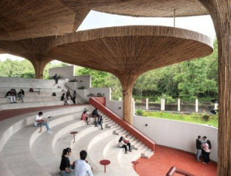 The Purple Ink Studio covers Tapmi Centre in India with bamboo parasol canopy Image